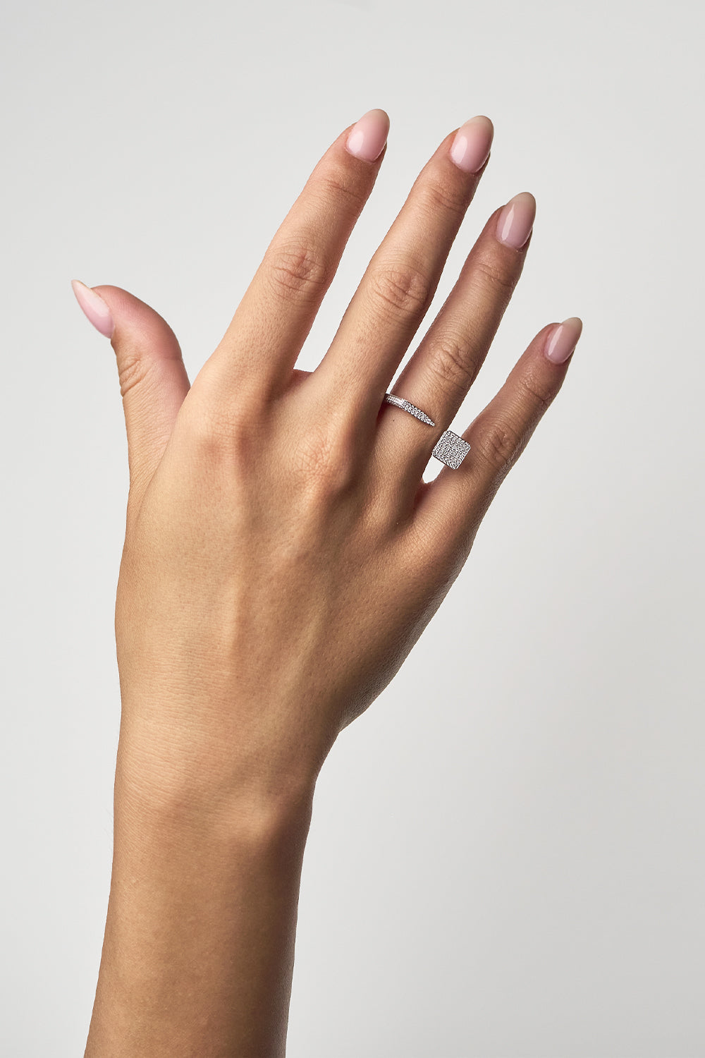 Ciufoli One sculptural white gold pin ring with pavé diamonds on model