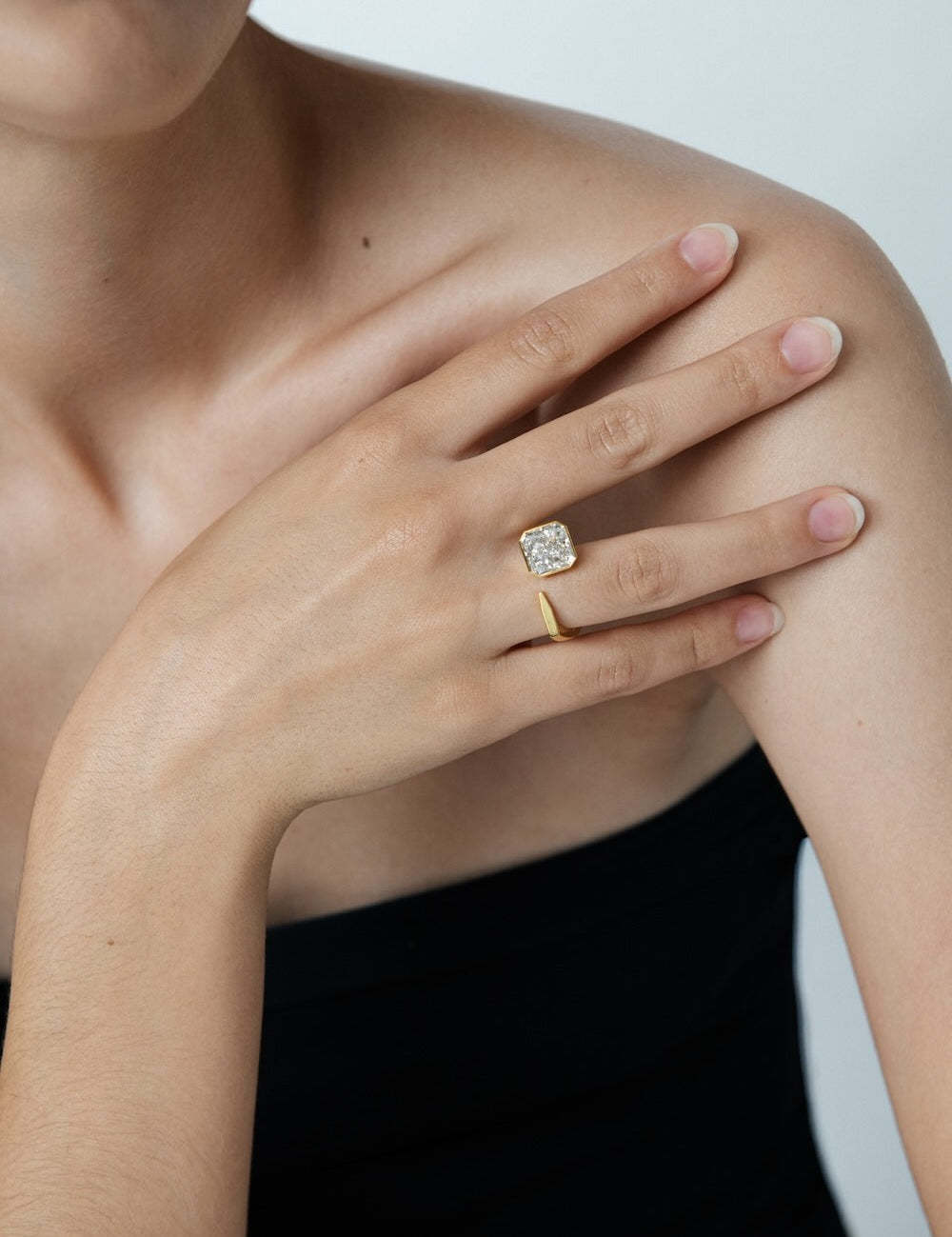 Ciufoli One sculptural yellow gold pin ring with diamond on model