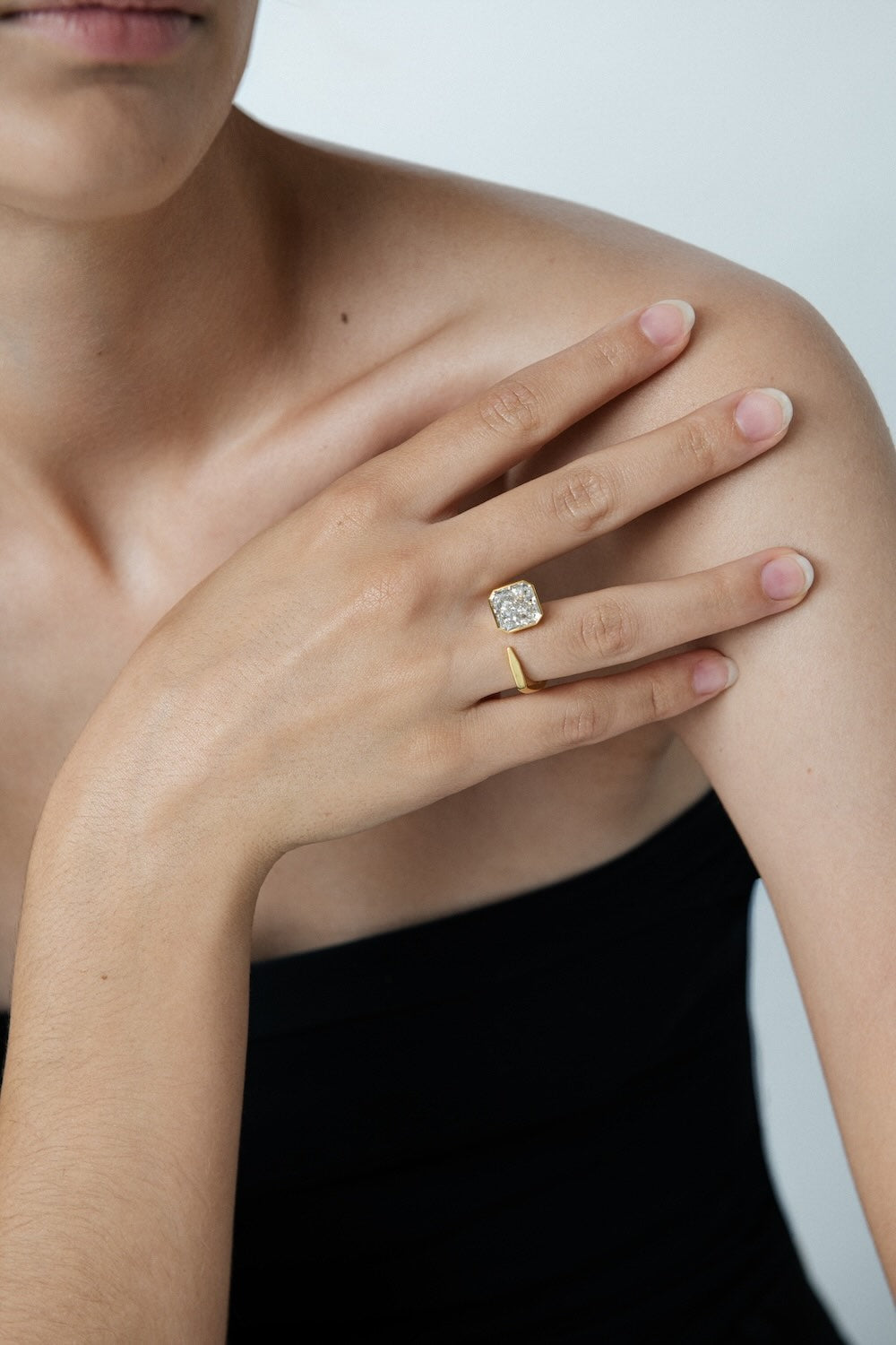 Ciufoli One sculptural yellow gold pin ring with diamond on model