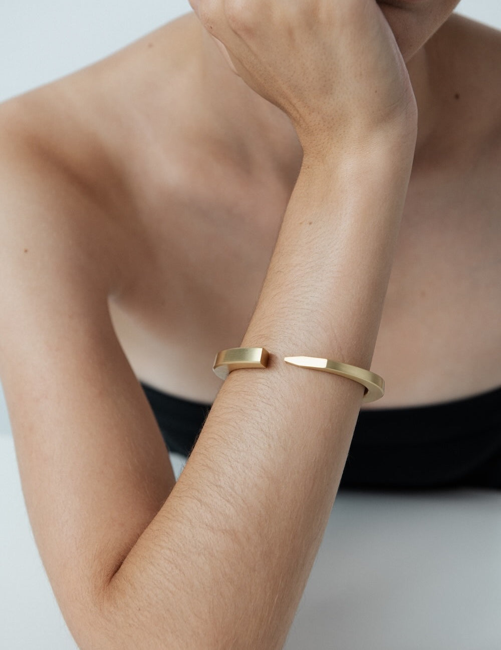 Ciufoli One sculptural yellow gold cuff bracelet on model
