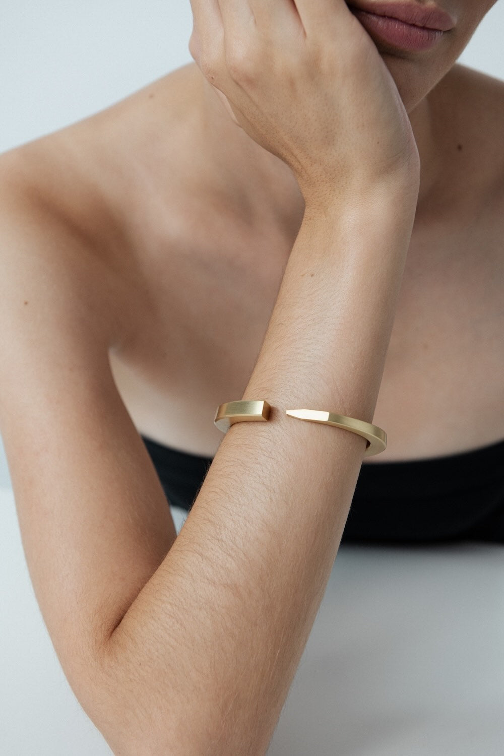 Ciufoli One sculptural yellow gold cuff bracelet on model
