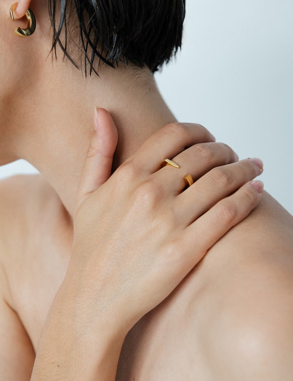 Ciufoli One sculptural yellow gold ring on model 